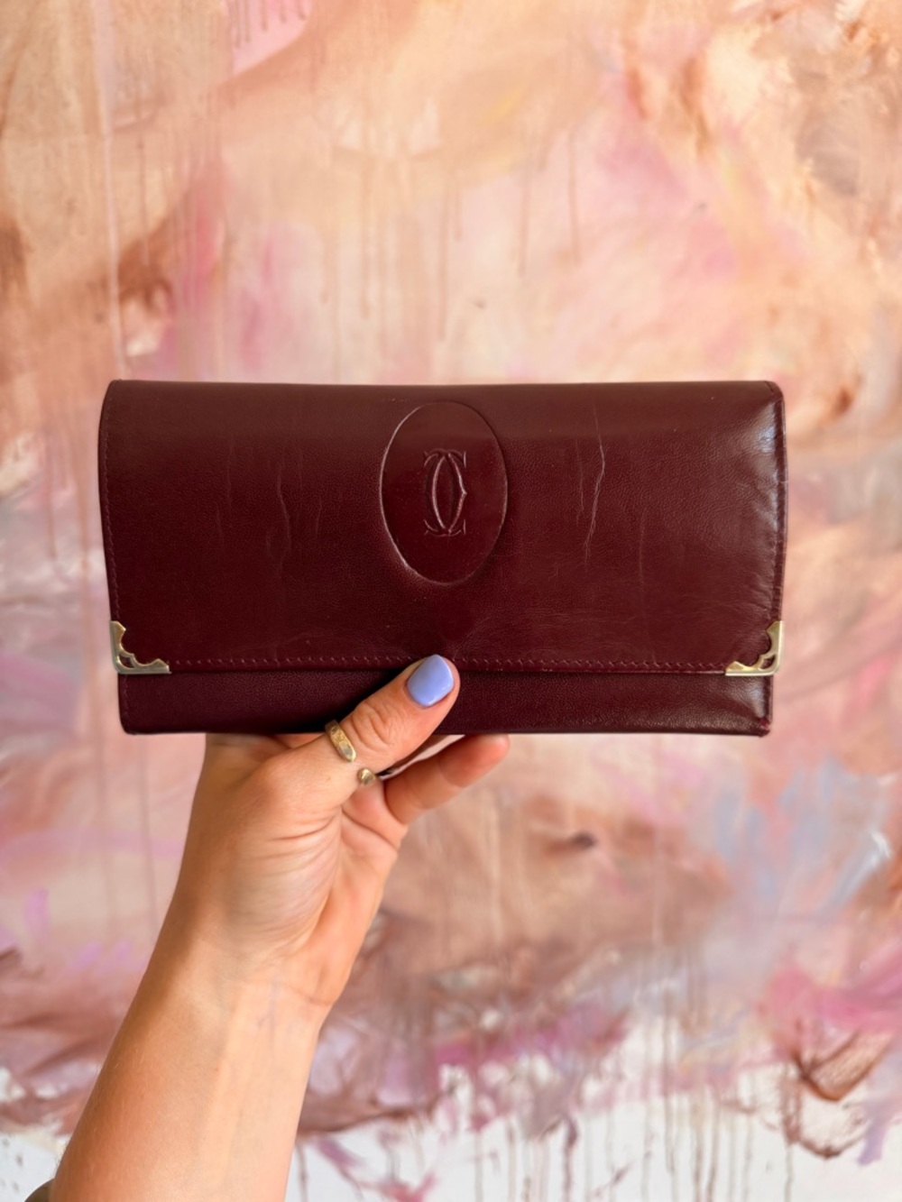 Cartier Wine Red Leather Continental Wallet with Gold Accents